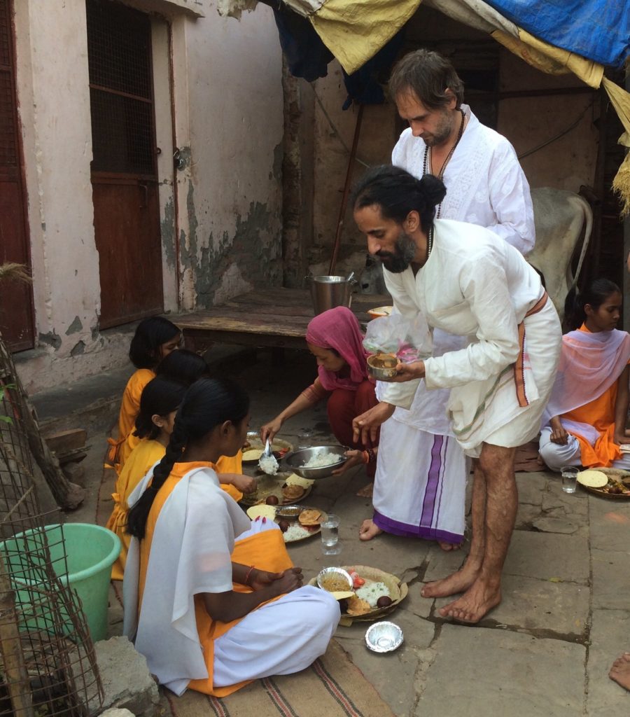 Serving the meal we cooked to the orphan children at the Lali Baba Ashram.