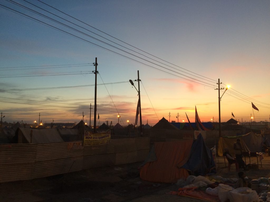 Sunrise photo of the tent communities set up beside the Sangam.