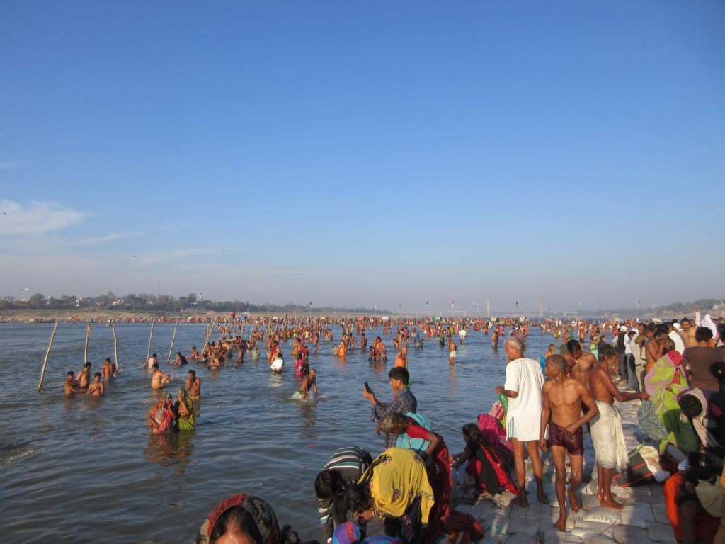 Thousands of Hindus dipping into the holy Sangam on the final pilgrimage day.