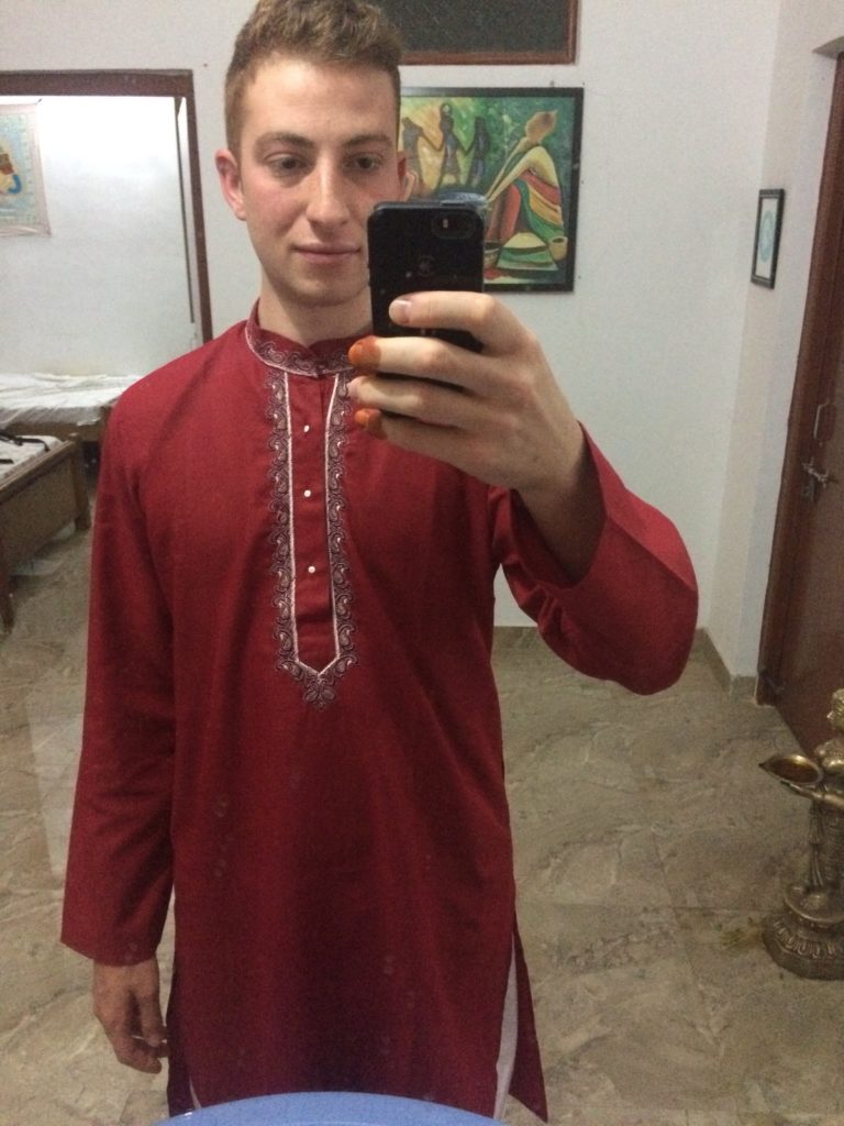 Wearing my Indian kurta with my fingers covered in henna. I had to deal with people asking if I had poop on my fingers for 4 weeks!