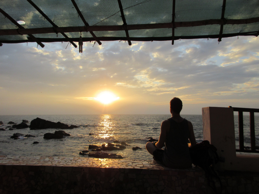 Meditating upon the peace and calmness of the oceans in Gao, India. 