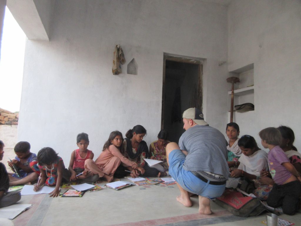 Giving English lessons to the children of one of the village families we gifted to.