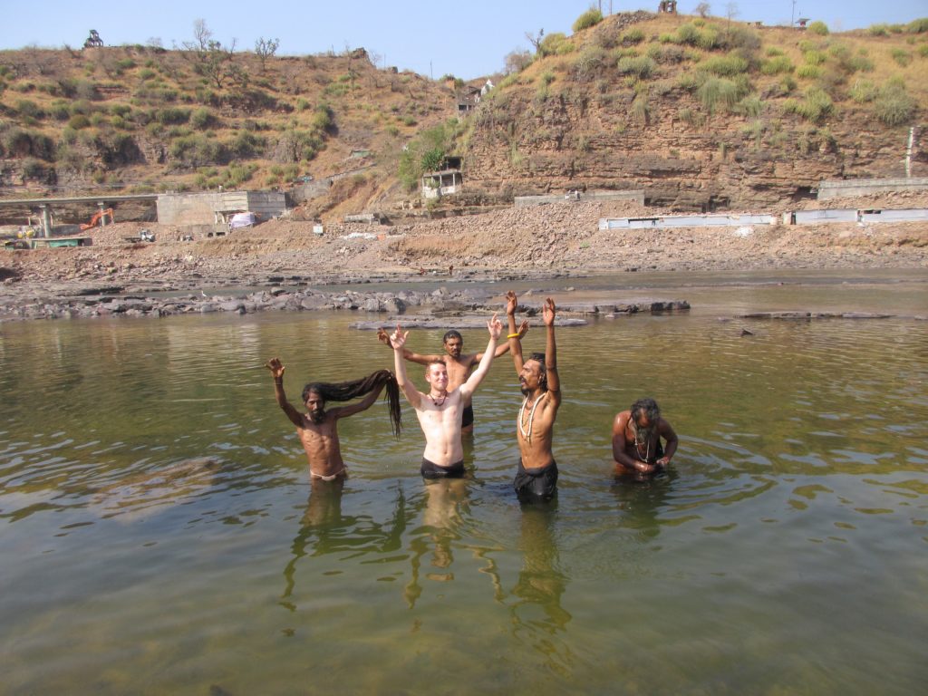 Absorbing the energy and yelling to Shiva after cleansing ourselves in the holy river.